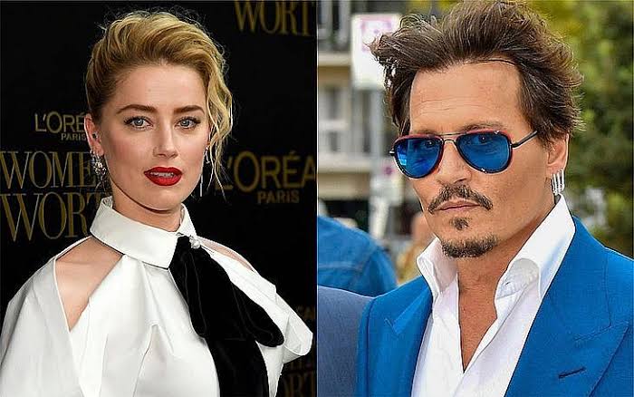 Amber Heard aparece com rosto machucado para comemorar vitórias sobre Johnny Depp